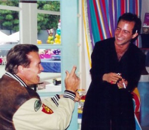 arnold catches simon red handed during a magic trick at schwarzenegger residence_magician for parties maria shriver and patrick and christina family magicians for hire